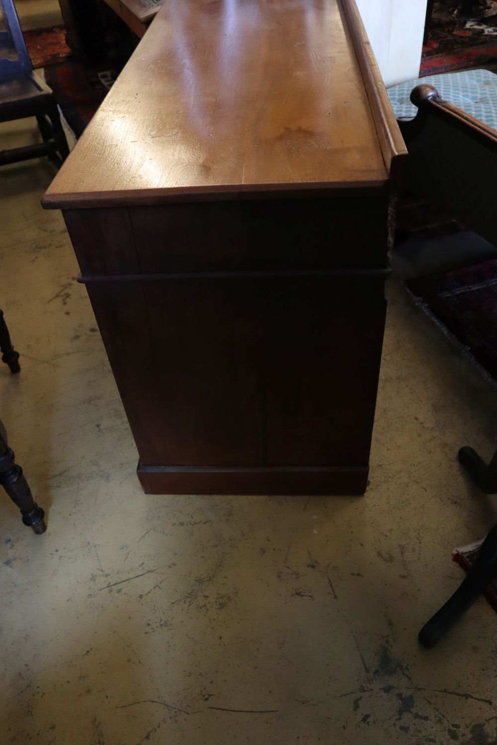 An early 20th century walnut kneehole desk, width 121cm, depth 52cm, height 78cm
